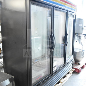Brand new True GDM-72-HC 3-door reach-in cooler, commercial-grade. Note visible broken glass. 115 volts, 1 phase.