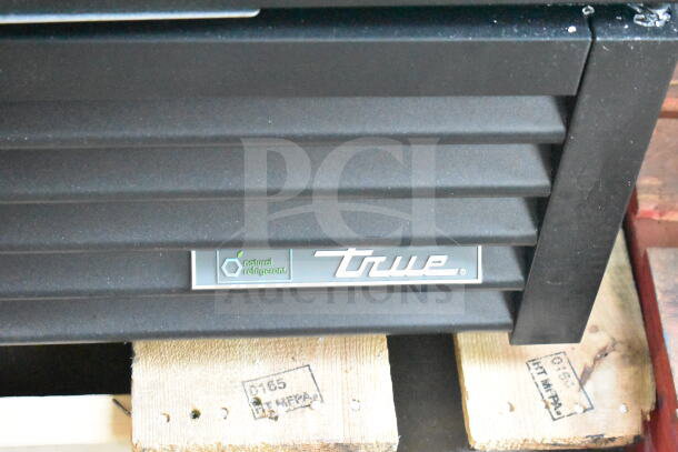 True GDM-72-HC cooler, black exterior, "natural refrigerant" label, on wooden pallet. 115V, 1 Phase; glass broken.