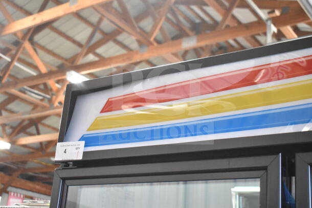 True GDM-72-HC merchandiser with three doors, visible broken glass, colorful display, 115 volts, 1 phase.