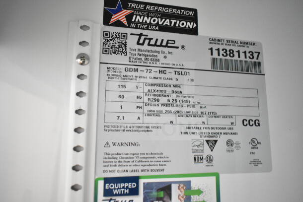 True GDM-72-HC cooler label shows model, voltage, refrigerant details, and warning. Shows product specs and safety info.