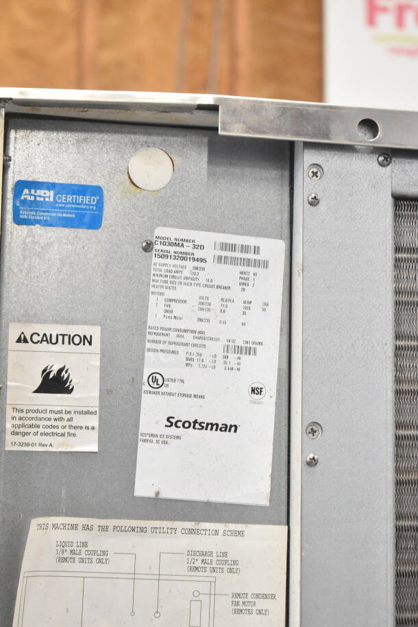 BRAND NEW Scotsman C1030MA-32D Ice Machine, 30" air-cooled, 1077 lb capacity, tags show AHRI, UL, and NSF certifications.