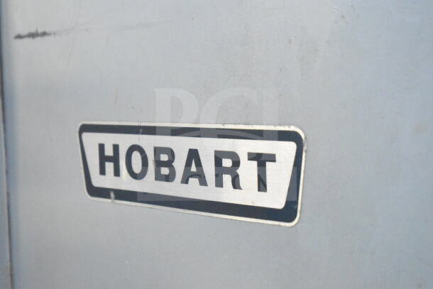 Hobart M-802 commercial planetary dough mixer label, indicating brand and model.
