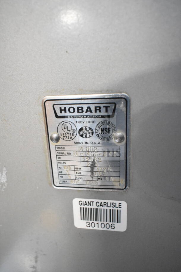 Hobart M-802 mixer tag showing model, UL, NSF certifications, 200V, 3 phase, with Giant Carlisle barcode.
