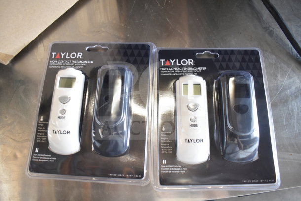 Taylor non-contact thermometers in original packaging; includes temperature range and scan hold features, excellent condition.