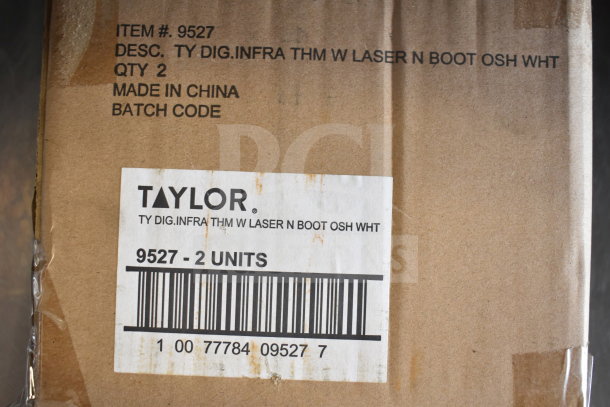 Cardboard box labeled with "Taylor" and item #9527, containing Taylor digital infrared thermometers with laser, two units, made in China.