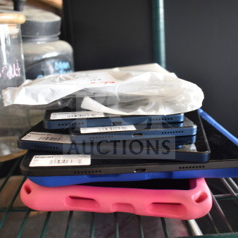 Seven various Onn tablets stacked, featuring visible USB ports. Some tablets have protective cases. Tags read "Walmart".