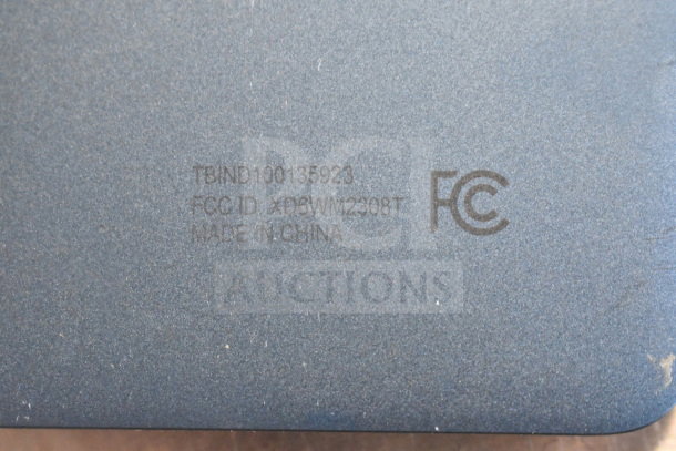 Back of an Onn tablet showing FCC and model markings: FCC ID XD6WM2908T, TBIND100135923, Made in China.