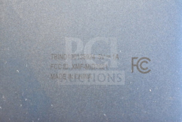 Image of the back of an Onn tablet showing model number TBIND100135924, FCC ID XMF-MID7021, and "Made in China."