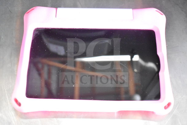 Assorted Onn tablets with pink protective case; condition appears used. Auction lot includes seven units.