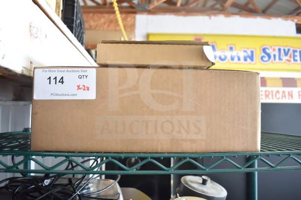 Boxed auction items including a Globe meat slicer blade remover and computer keyboard, labeled "114 QTY X2."