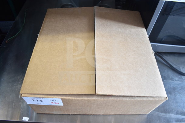Cardboard box containing a Globe meat slicer blade remover and computer keyboard. Auction label marked "114, QTY 2x".