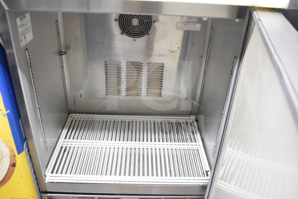 Silver King SKF2A refrigerated prep table, stainless steel interior, visible fan, and ventilated rack, 115V, 1 phase.