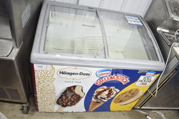 Commercial freezer merchandiser with glass sliding doors featuring Häagen-Dazs and Nestlé branding. 115 volts, 1 phase.