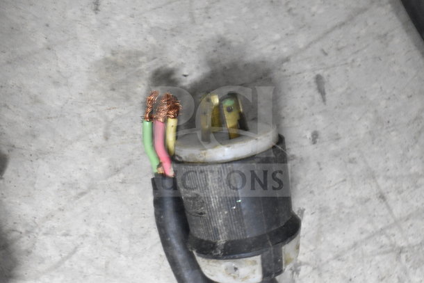Broken electrical plug from Taylor 632-33 Milkshake Machine, showing exposed wires. Needs repair or replacement.
