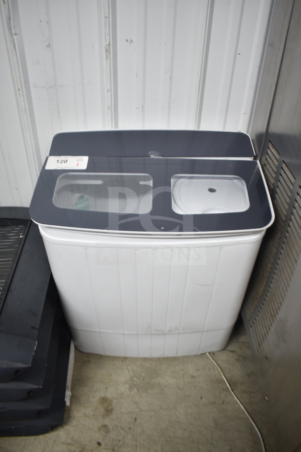 H01GN001 washing machine, 110V, 1 phase. Dual compartment top, visible label indicating model. Gently used condition.