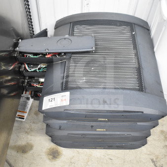 Four Cree lights stacked, metal casing with ventilation grilles, visible wiring, auction label "121 QTY x4."