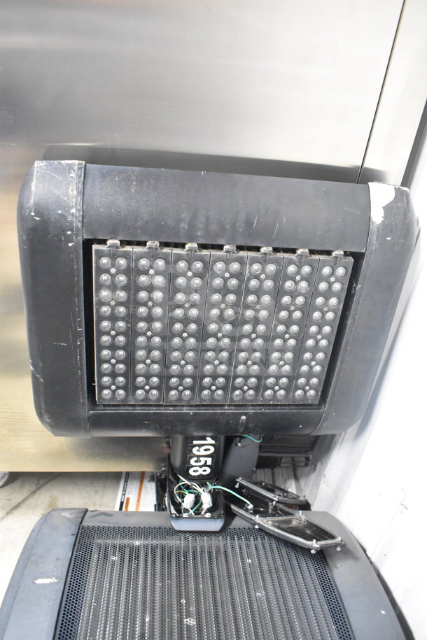 4 Cree LED lights, showing rectangular array. Slight wear. Serial number 1958 visible. Auction item.