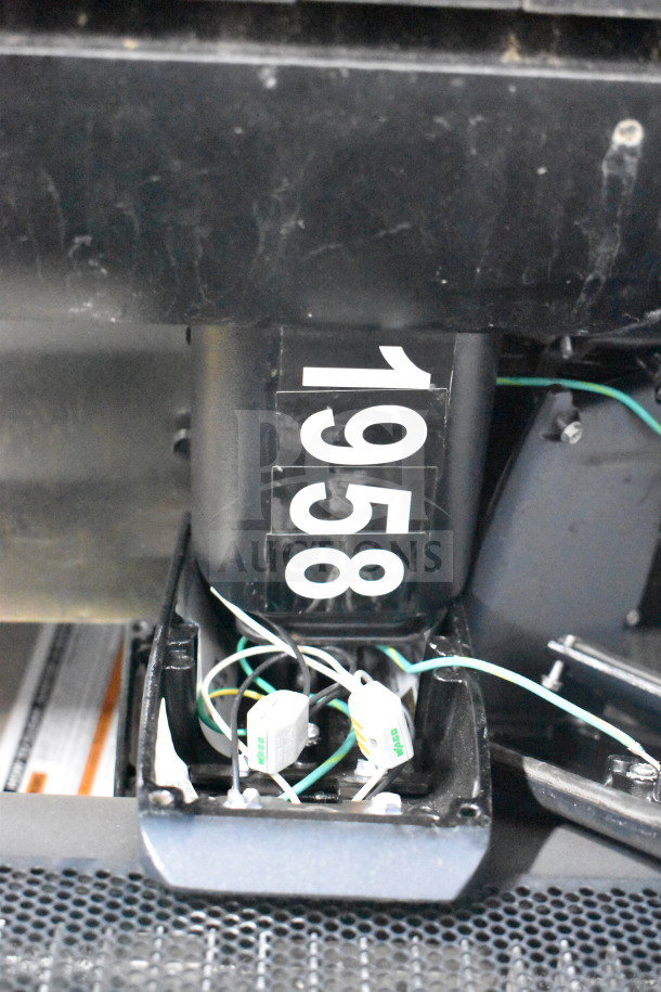 "Set of 4 Cree lights with wiring exposed, numbered '1958,' in good condition for auction, enhancing bidding value."
