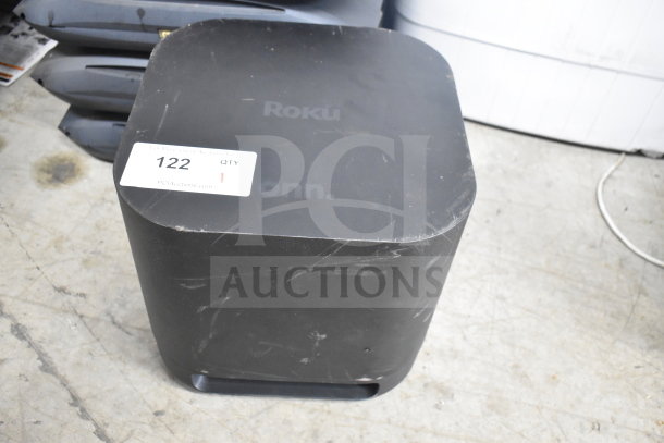 Onn 100002420 Roku Wireless Subwoofer, black, surface scratches, auction tag "122", enhancing low-frequency audio.