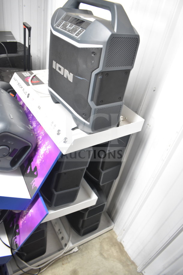 5 Ion Party Boom Plus speakers in store display. Each features robust design, control panel, and carry handle. Excellent condition.