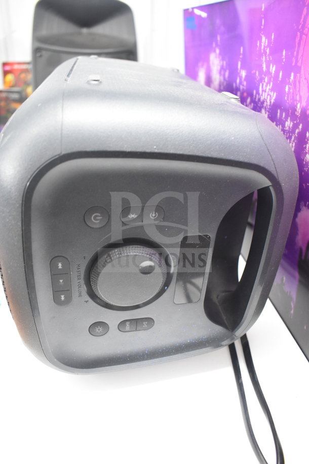 Onn medium party speaker, store display condition, features include volume knob, power, and Bluetooth buttons.