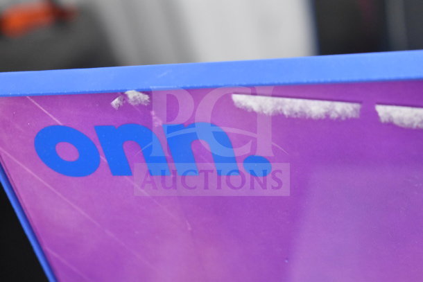 Onn display sign in blue and purple with brand logo, indicating inclusion of Onn Medium Party Speaker in auction.