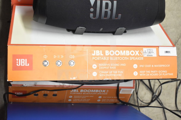 JBL Boombox 3 speaker on display box. Features include massive sound, IP67 waterproof, and 24-hour playtime.