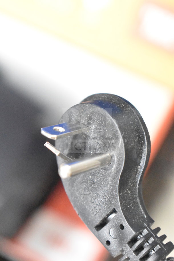 Power cord close-up of JBL Boombox Speaker display. Features standard plug; condition shows slight wear.