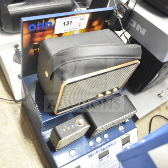 Store display featuring Soundcore Anker Wi-Fi speaker, multiple models, with controls, in working condition.
