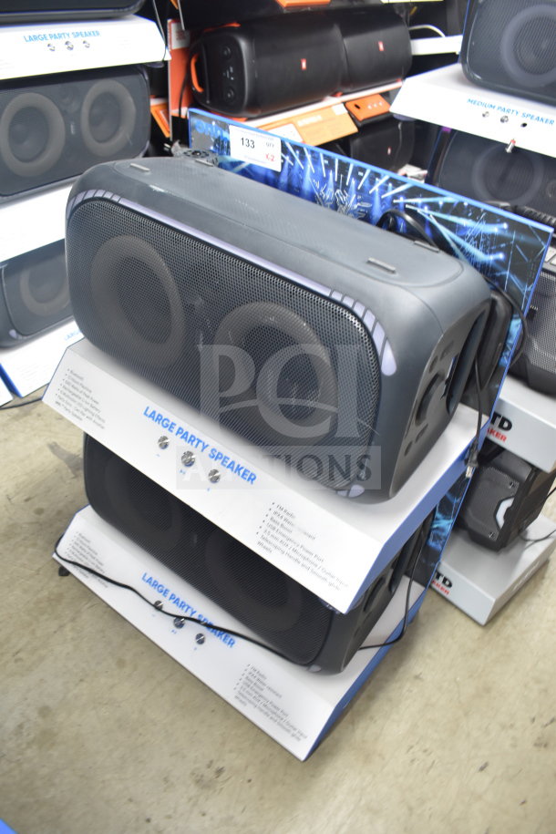 Onn Large Party Speaker display, featuring two units. Visible tags indicate model and features. Ideal for parties.