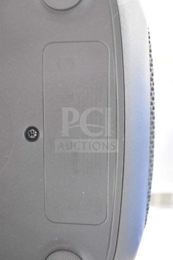 Onn Large Party Speaker on display stand. Features durable design, clear labeling. Ideal for events, excellent condition.