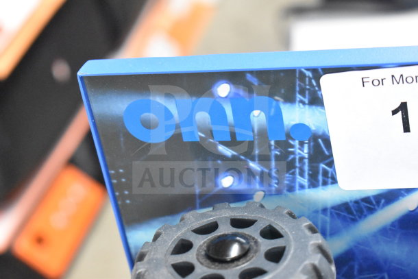 Onn store display with large party speaker. Blue background with concert lighting design and black gear element.