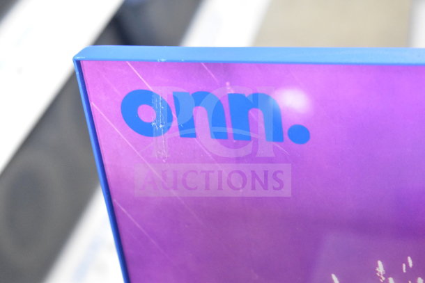 Onn Medium Party Speaker display, purple with blue "onn." branding, slight surface scratches visible.