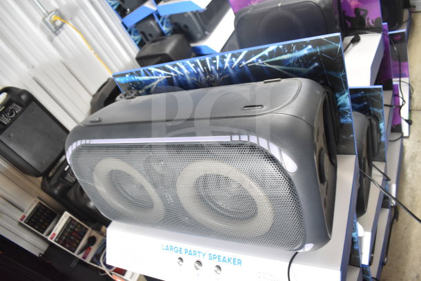 Onn large party speaker on display, featuring dual woofers, LED lights, and control buttons. New condition.