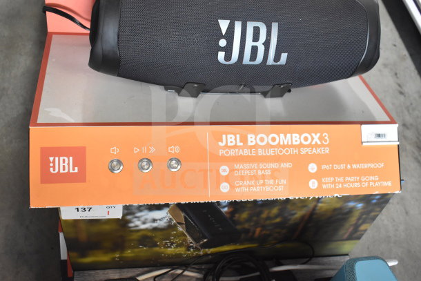 JBL Boombox 3 speaker on display. Features include deep bass, 24-hour playtime, IP67 waterproof rating.