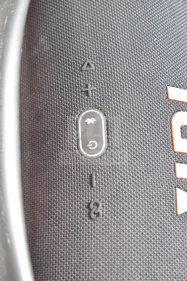 Close-up of JBL Boombox 3 display panel, showing control buttons and textured surface. Ideal for audio enthusiasts.