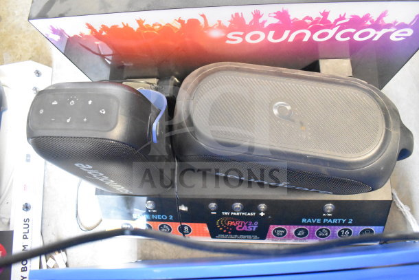 Two-store display featuring Altec Lansing and Soundcore speakers, showcasing the Party 2.0 Blast feature.