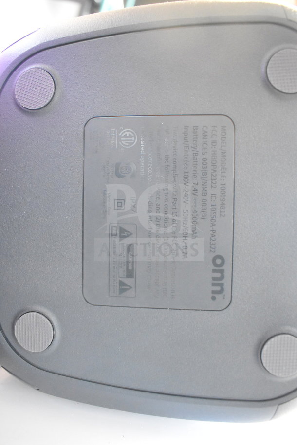 Bottom of Onn Medium Party Speaker model 100049812 with information label showing specifications and certifications.