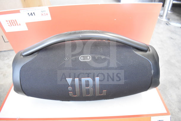 JBL Boombox 3 speaker on display with prominent branding and controls, excellent condition. Auction tag indicates double bid value.