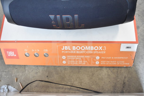 JBL Boombox 3 portable Bluetooth speaker display with IP67 waterproof rating, featuring controls and brand logo.