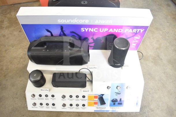 Store display featuring JBL Boombox 3 and Soundcore speakers. Includes Select Pro, Mini 3 Pro, and other models.