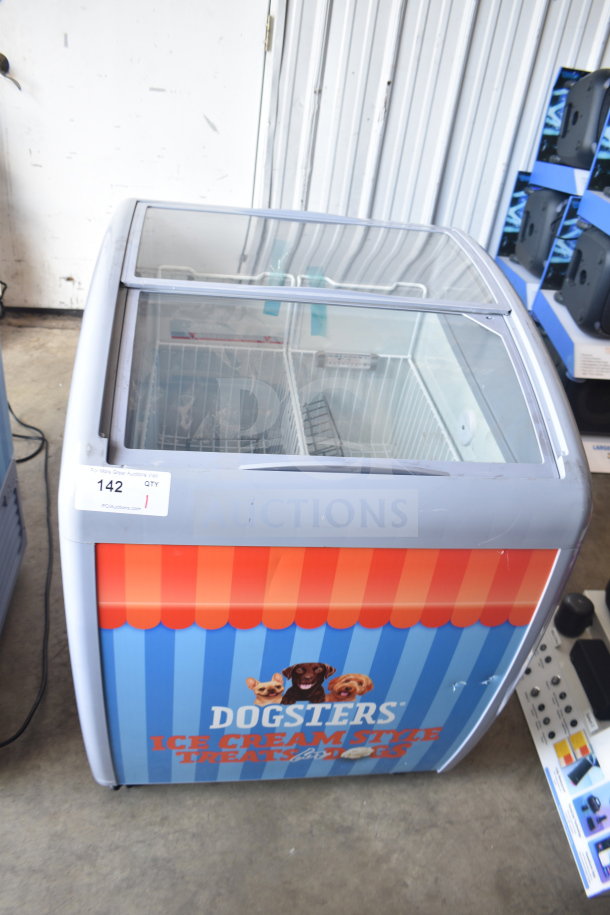 Commercial chest freezer merchandiser, 115 volts, 1 phase, featuring "Dogsters" branding, sliding glass top. In good condition.