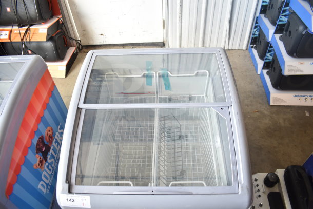 XS-160Y Commercial Chest Freezer Merchandiser, glass lid, 115 volts, 1 phase, interior baskets, seen in good condition.