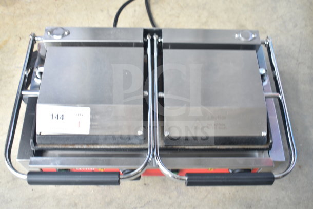 2023 Avantco 177PG400S double panini press, stainless steel, 120V, 1 phase, with grip handles; item tag reads "144".