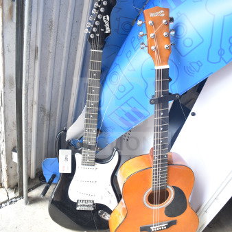 Two Rock Jam guitars, electric and acoustic, in good condition. Visible auction tag "145."