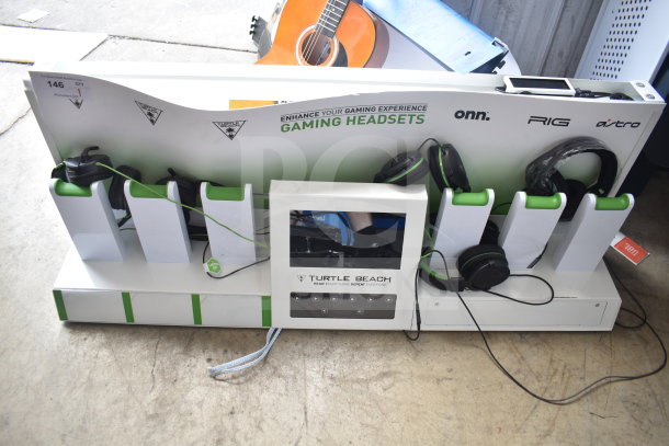 Turtle Beach store display with various gaming headsets. Features logos for onn., RIG, and Astro. Headphones included.