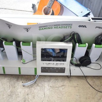 Turtle Beach store display with various gaming headsets. Features logos for onn., RIG, and Astro. Headphones included.