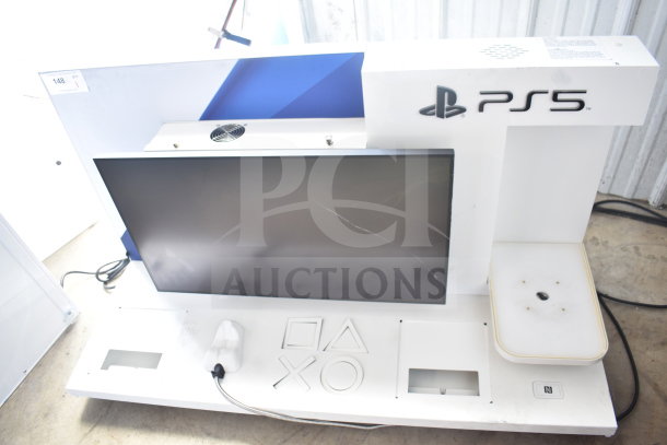 PS5 Outform UE200205-C commercial store display with monitor, console placeholders, and PlayStation branding.