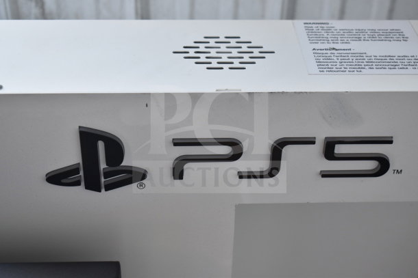 PS5 Outform UE200205-C commercial display unit, showing the PS5 logo and ventilation. Noticeable wear on the surface.
