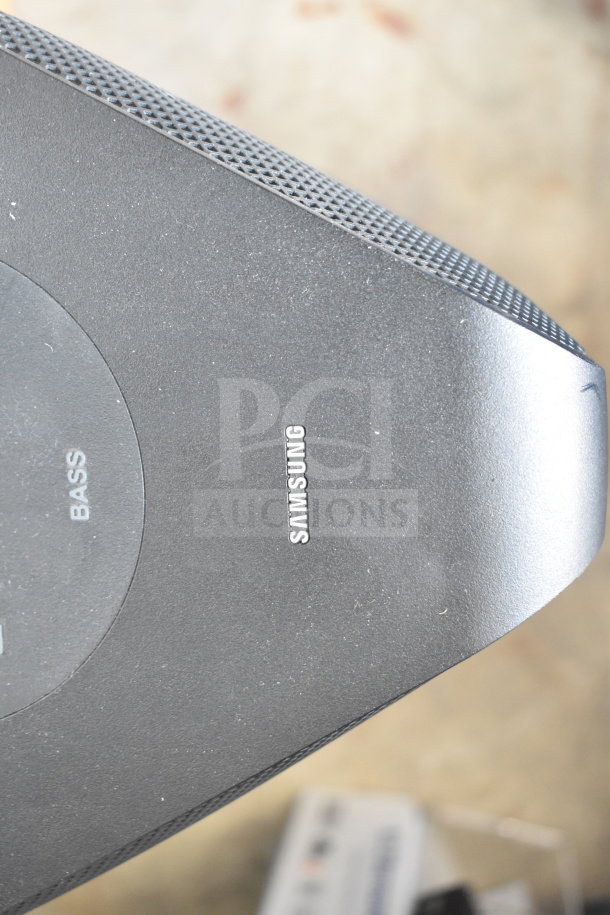Samsung MX-ST4CB speaker, black, with visible brand logo and bass control label, in good condition.